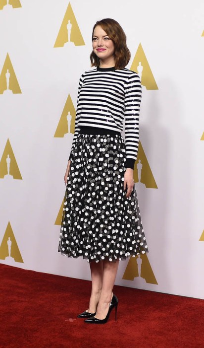 Emma Stone looking sweet in polka dots and stripes. Getty Images